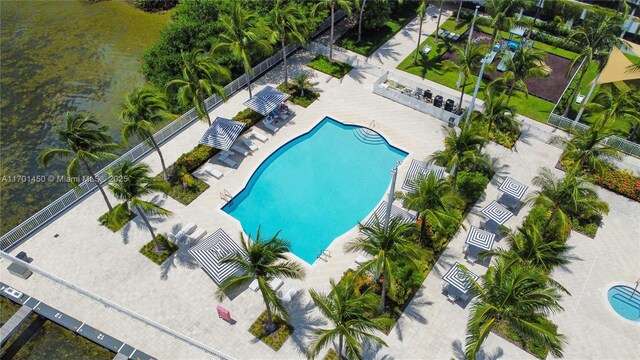 birds eye view of property with a water view