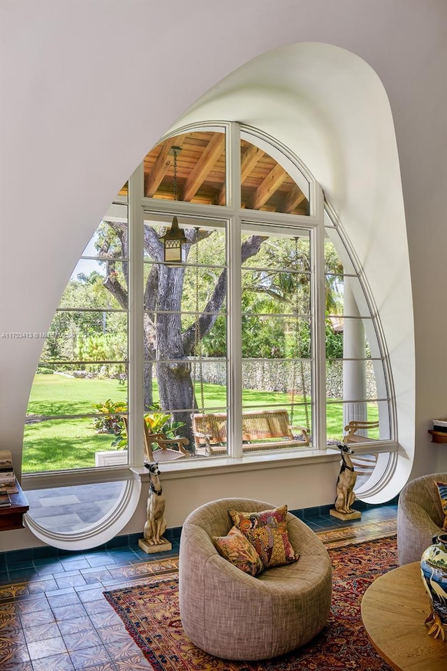 sunroom featuring wooden ceiling