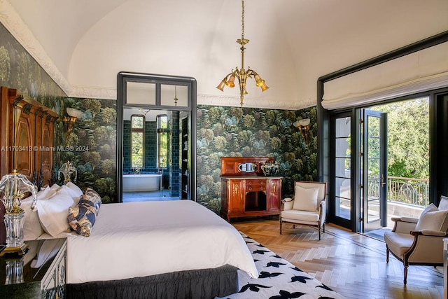 bedroom with access to exterior, high vaulted ceiling, light parquet floors, and a notable chandelier