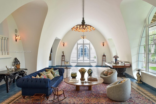 living room with a healthy amount of sunlight and a towering ceiling