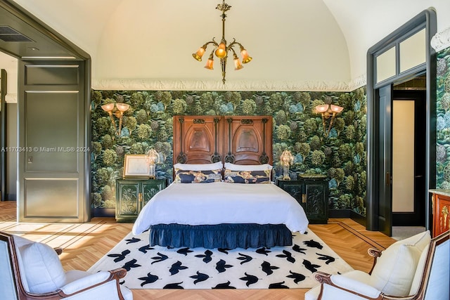 bedroom with a notable chandelier, lofted ceiling, and parquet flooring