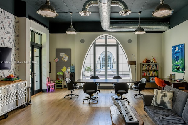 recreation room featuring hardwood / wood-style floors and french doors