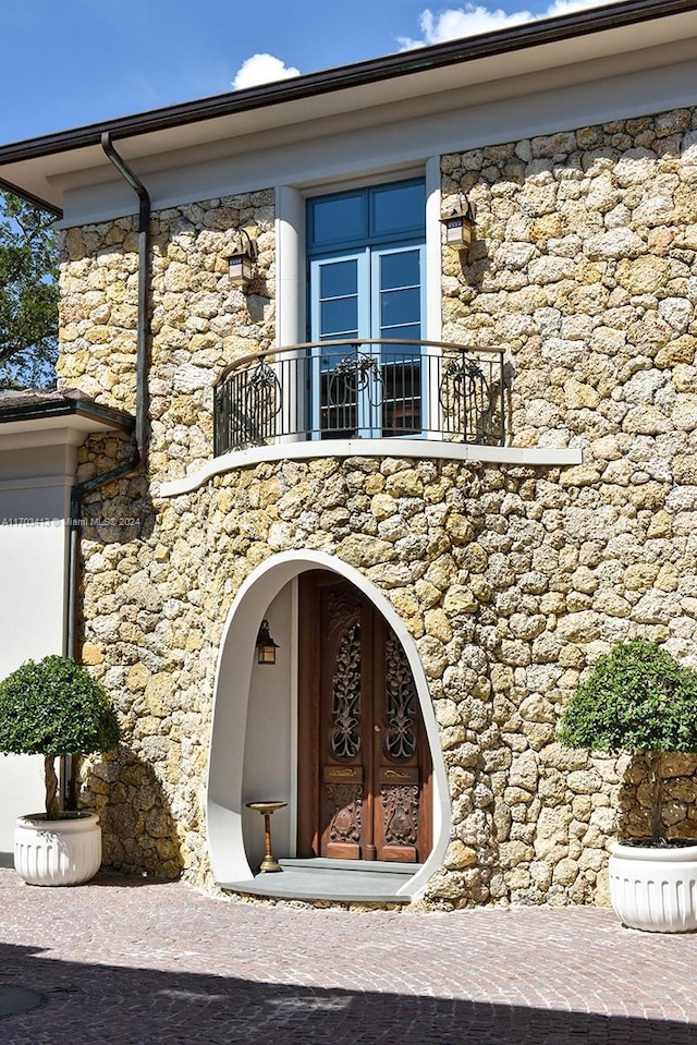 doorway to property featuring french doors and a balcony