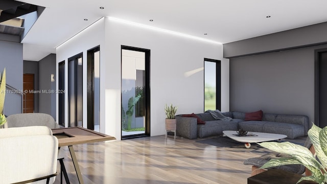 living room with plenty of natural light and wood-type flooring