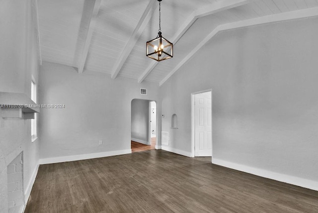 interior space featuring high vaulted ceiling, an inviting chandelier, dark hardwood / wood-style floors, a fireplace, and beamed ceiling