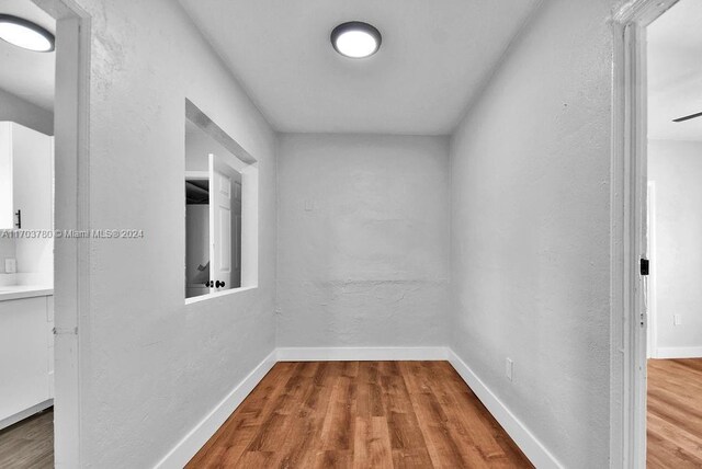 hallway featuring hardwood / wood-style flooring