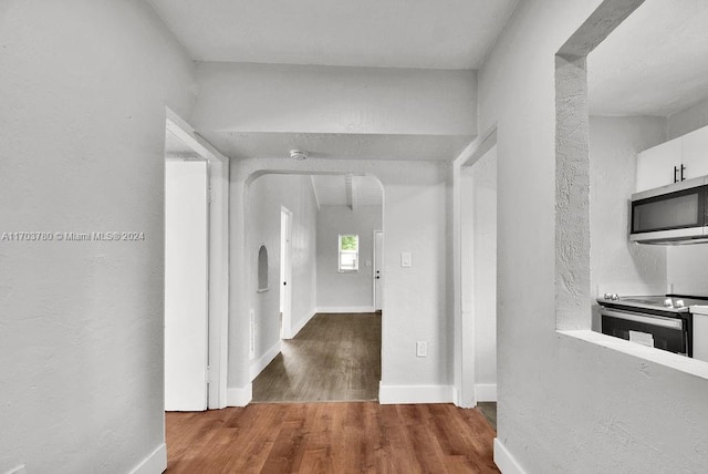 hallway featuring dark wood-type flooring