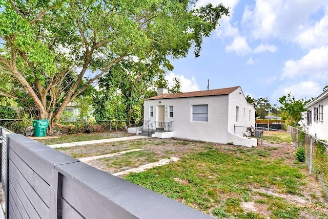 exterior space with a front yard