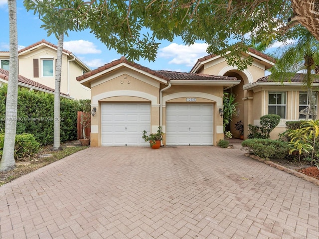 mediterranean / spanish-style home featuring a garage