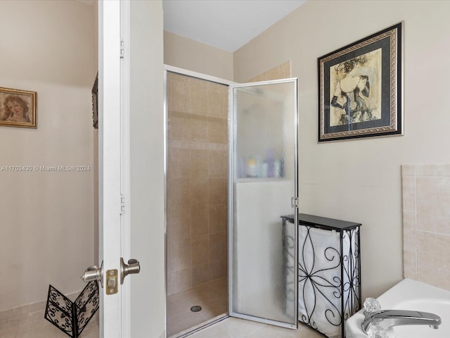 bathroom featuring shower with separate bathtub and tile patterned floors