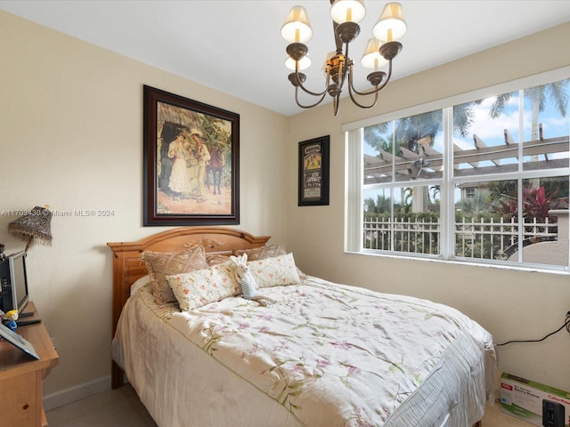 bedroom with a notable chandelier