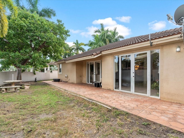 back of house with a patio