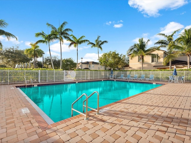 view of swimming pool with a patio area