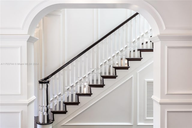 staircase with ornamental molding