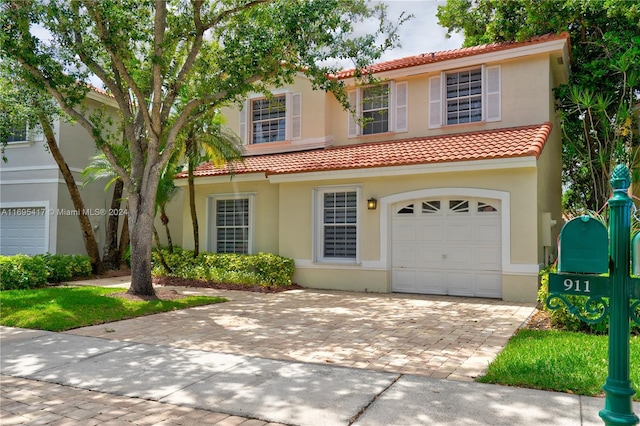 view of front of property with a garage