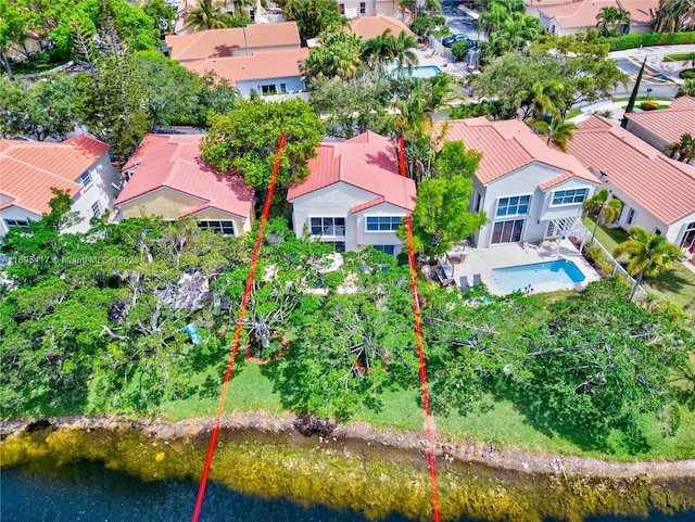 bird's eye view featuring a water view and a residential view