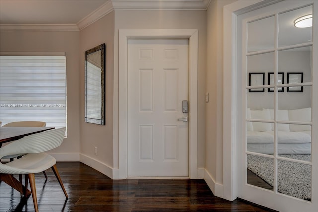 entryway with baseboards, dark wood-style flooring, and crown molding