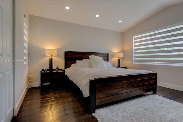 bedroom with baseboards, vaulted ceiling, wood finished floors, and recessed lighting