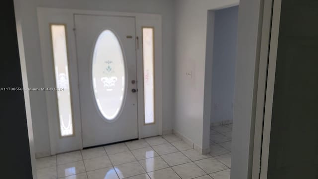 tiled entrance foyer with a wealth of natural light