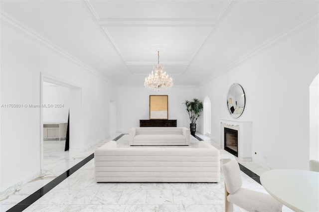 bedroom featuring a high end fireplace, ornamental molding, and a notable chandelier