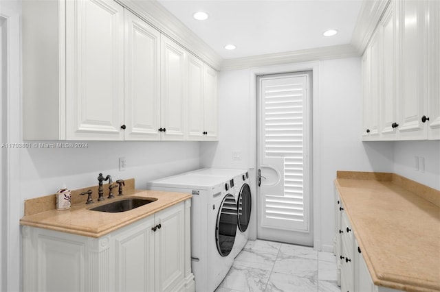 washroom with separate washer and dryer, sink, and cabinets