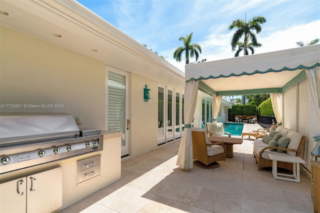 view of patio / terrace featuring an outdoor hangout area, area for grilling, and grilling area