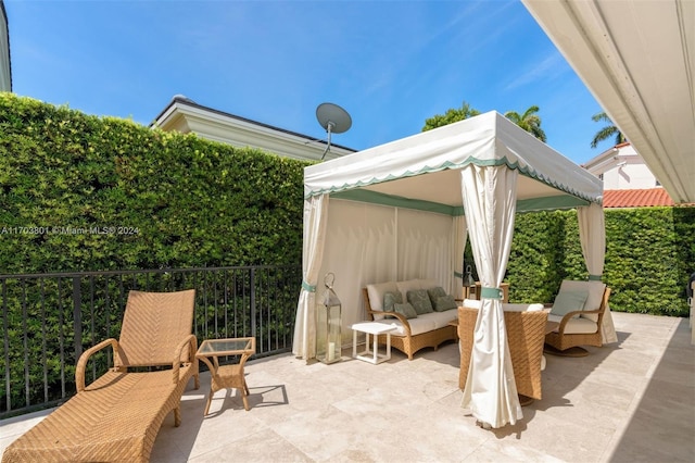 view of patio featuring a gazebo and an outdoor hangout area