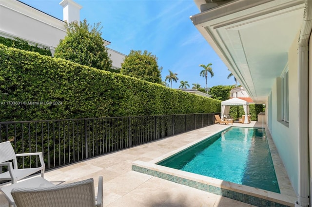 view of pool with a gazebo and a patio