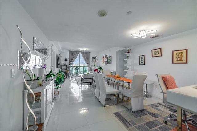 dining room featuring light tile patterned flooring