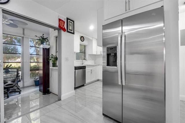 kitchen featuring white cabinetry, sink, and stainless steel appliances