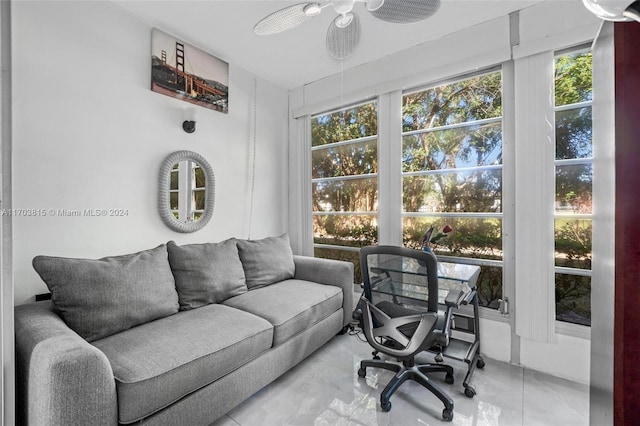 sunroom with ceiling fan and a healthy amount of sunlight