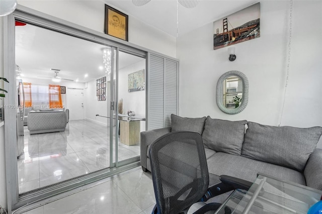 living room with marble finish floor and a ceiling fan