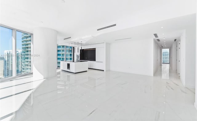 living room with floor to ceiling windows