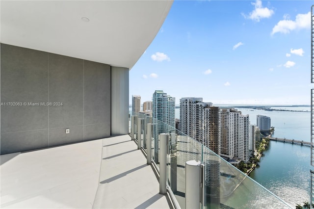 balcony featuring a water view