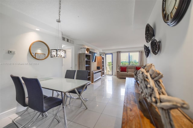 dining area featuring light tile patterned floors