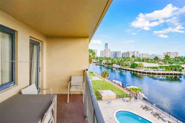 balcony featuring a water view