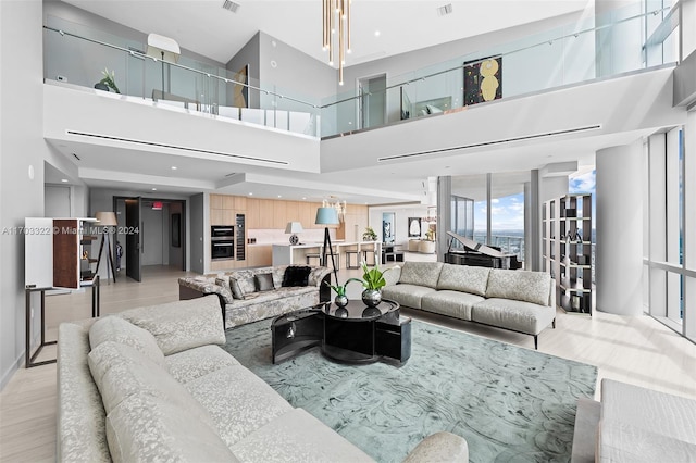 living room featuring a towering ceiling