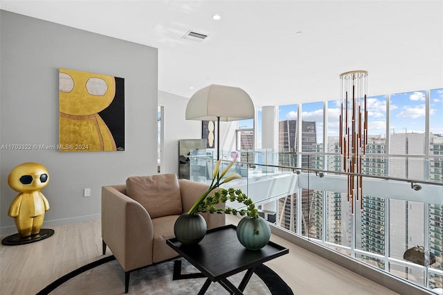 interior space featuring light wood-type flooring, expansive windows, and plenty of natural light