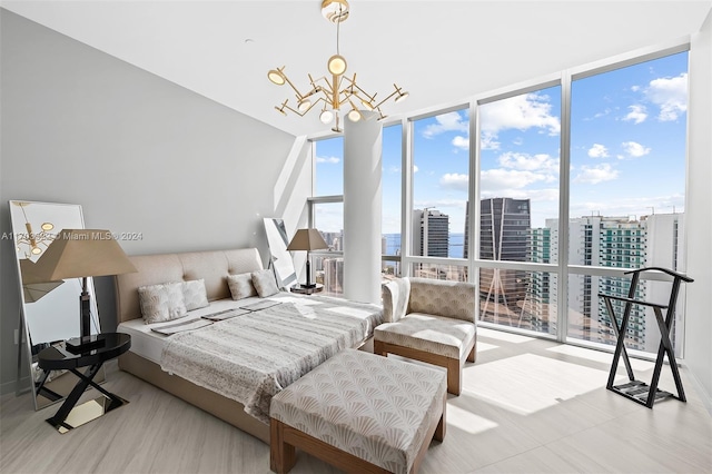 bedroom with a wall of windows, a notable chandelier, and multiple windows