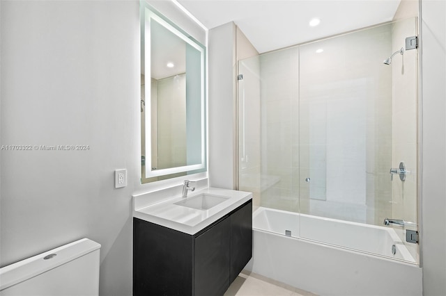 full bathroom featuring bath / shower combo with glass door, toilet, and vanity