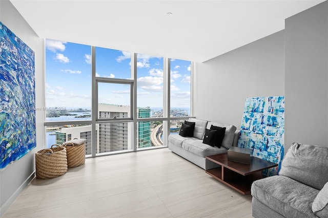 living room featuring expansive windows and a water view