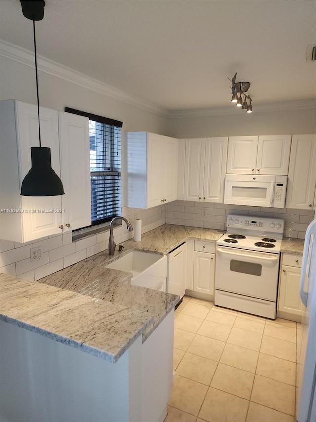 kitchen featuring white cabinets, light stone countertops, white appliances, and sink