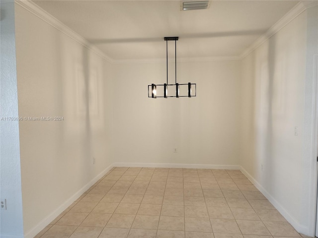 tiled empty room featuring ornamental molding