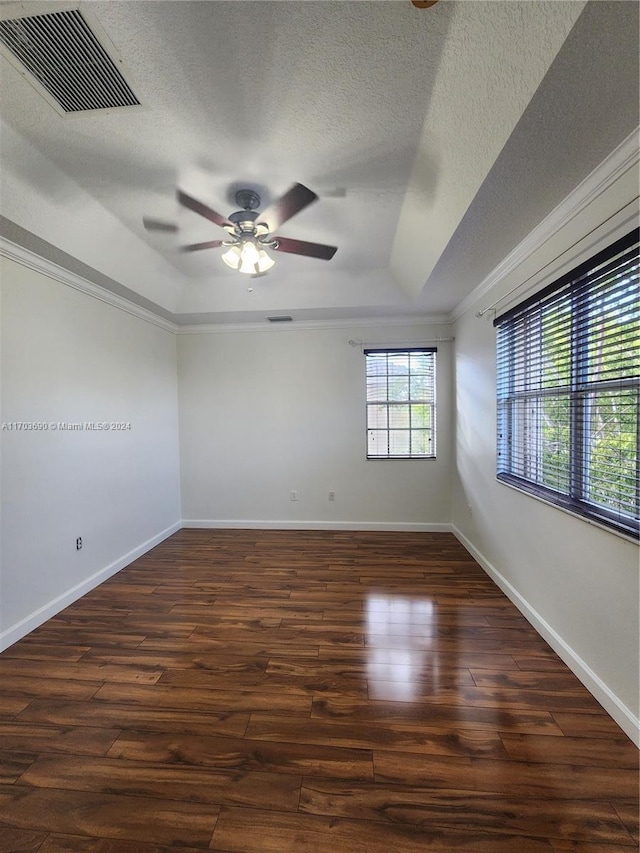 unfurnished room with a textured ceiling, dark hardwood / wood-style floors, and ceiling fan