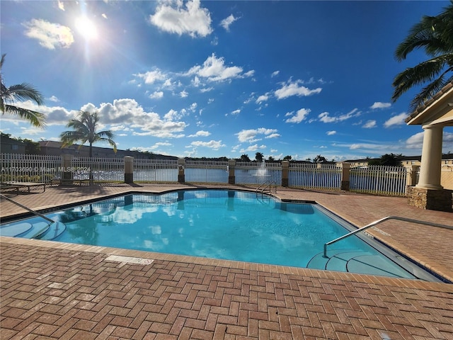 view of pool featuring a patio