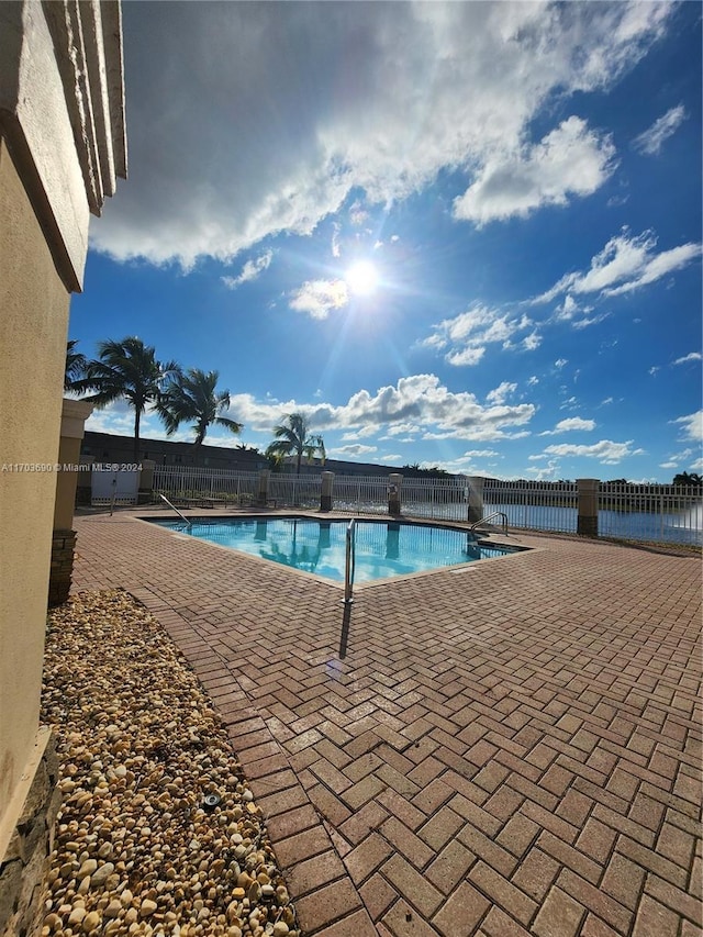 view of swimming pool with a patio area