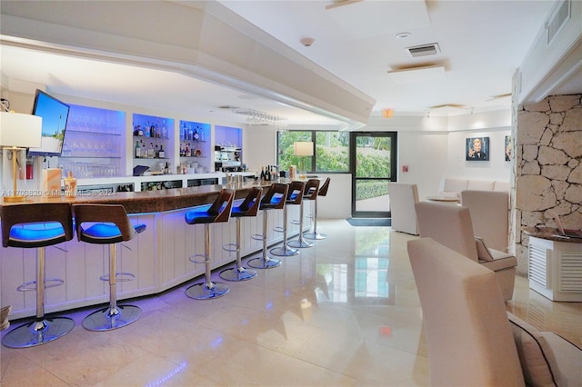 bar with light tile patterned floors