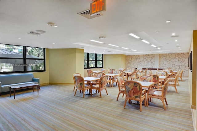 dining space with light carpet