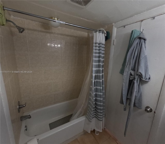 bathroom featuring tile patterned floors and shower / tub combo