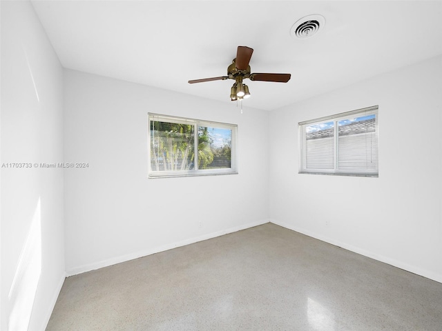 unfurnished room with ceiling fan